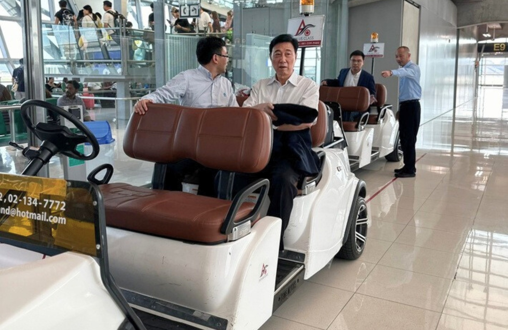 Golf cart transfer inside airport terminal